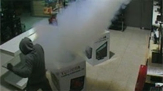 CCTV still of security fog in action in computer store