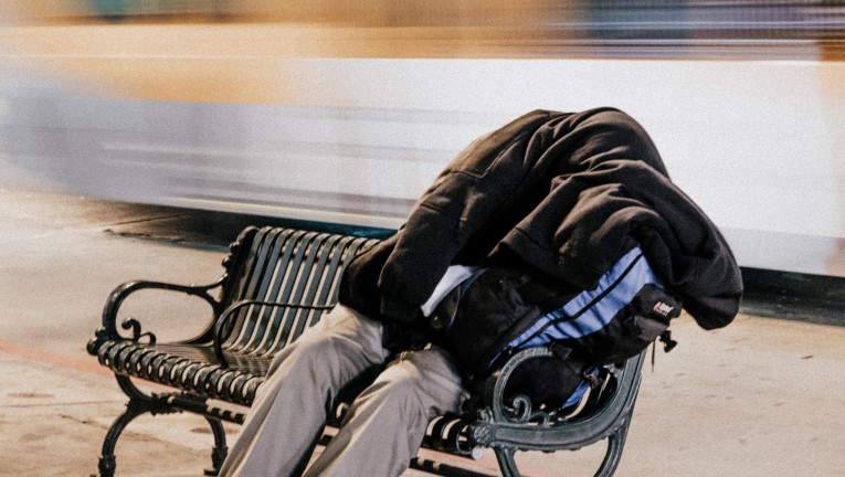 Homeless man in train station