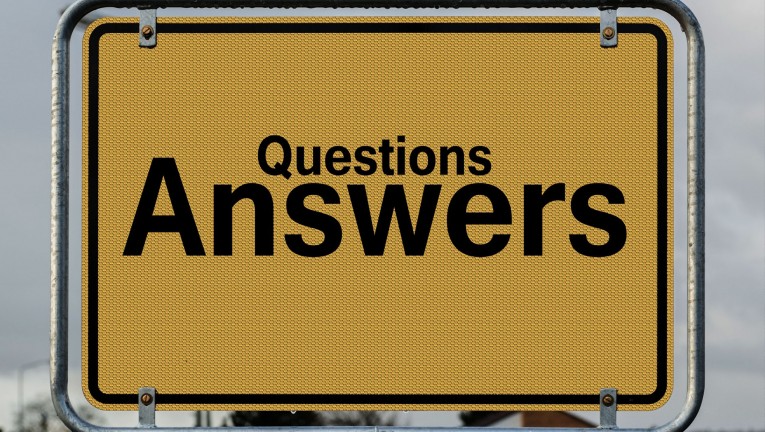 Yellow sign saying questions and answers