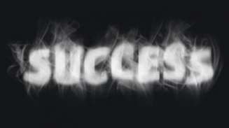 The word success written in smoke