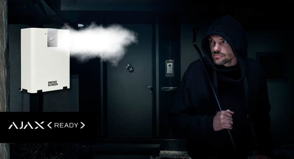 Smoke Screen fog generator deploying dense security fog as intruder approaches at night.