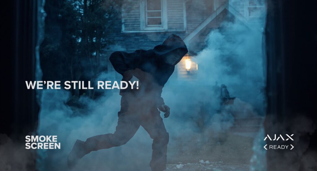 Intruder fleeing through dense security fog — Smoke Screen Ajax Ready active protection
